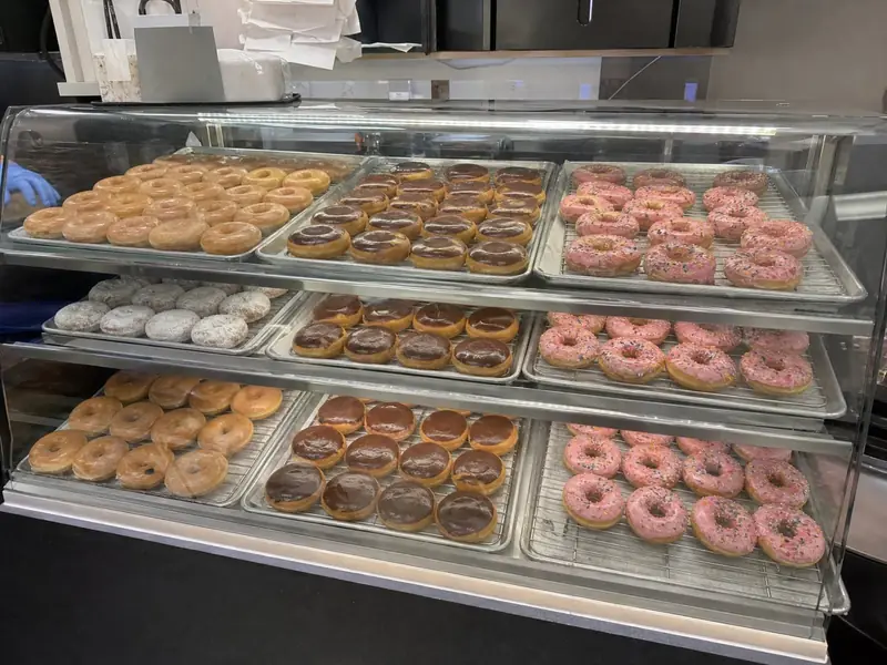 Donut case full and faced by 6 AM (pass)